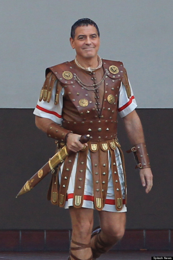 George Clooney dressed as a gladiator seen coming out of a taxi cab while filming scenes for the movie 'Hail Caesar' at Union Station
