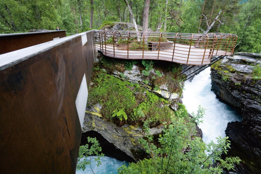 to-reach-some-of-the-pods-guests-need-to-traverse-this-curved-steel-bridge-that-hovers-above-the-rapids