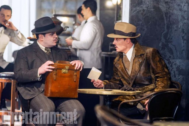 Josh-Gad-as-Hector-MacQueen-and-Johnny-Depp-as-Edward-Ratchett-in-Murder-on-the-Orient-Express